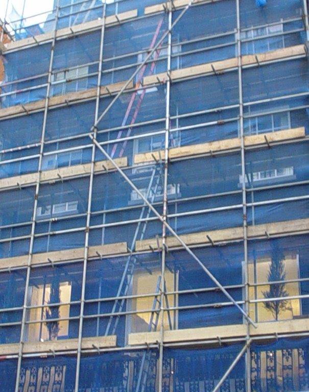 scaffolding system surrounded by debris netting